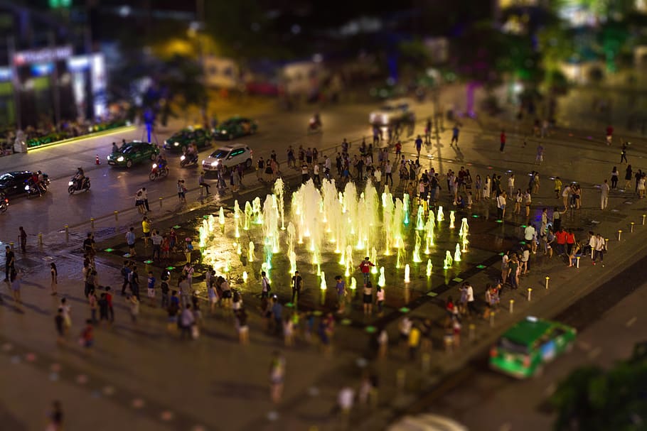 fountain, park, water, lights, blur, car, vehicle, city, people HD wallpaper