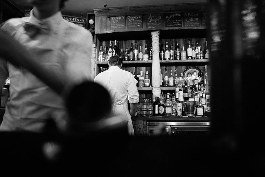 Grayscale Photography of Man Standing Beside Cabinet, alcohol HD wallpaper