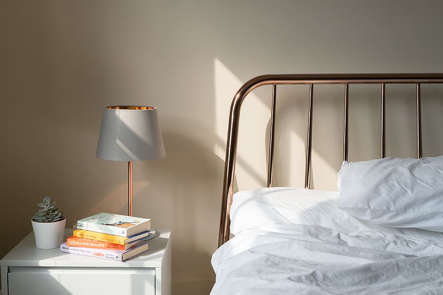 table lamp on white wooden nightstand beside bed, book, succulent HD wallpaper