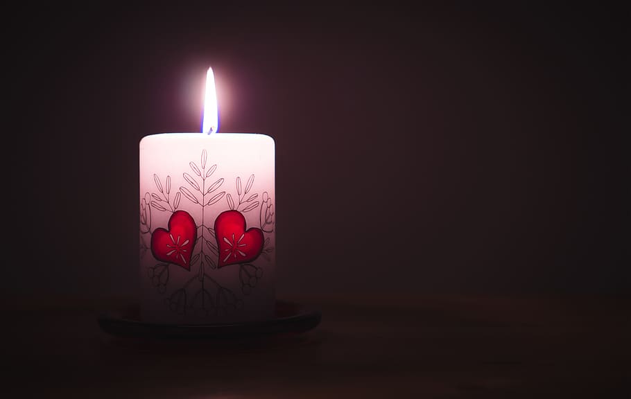 Close-up of Illuminated Candle Against Black Background, burning HD wallpaper