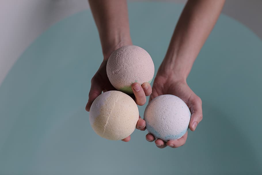 Person Holding Three Bath Bombs, ball, blur, child, conceptual HD wallpaper