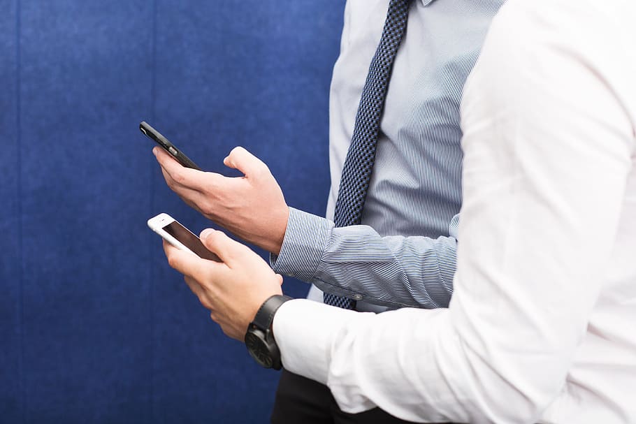 Colleagues Using Cell Phones Photo, Business, iPhone, Meetings HD wallpaper