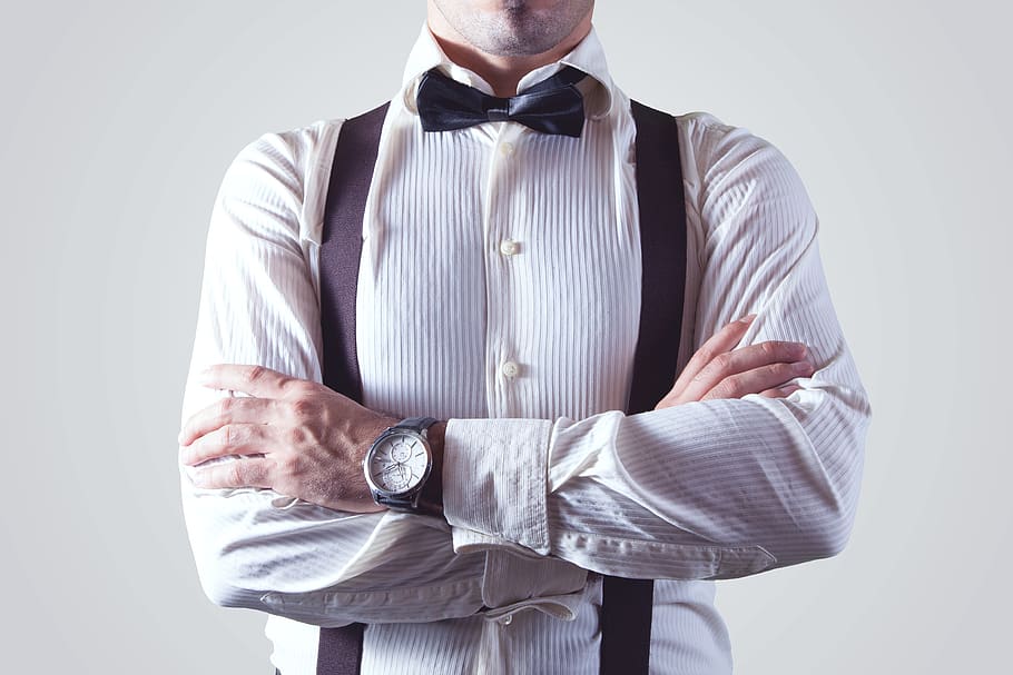 Man With Both Hands on Arm, adult, arms crossed, bow tie, braces