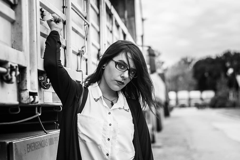 Woman With Zip-up Jacket Stand Beside Truck, adult, black-and-white