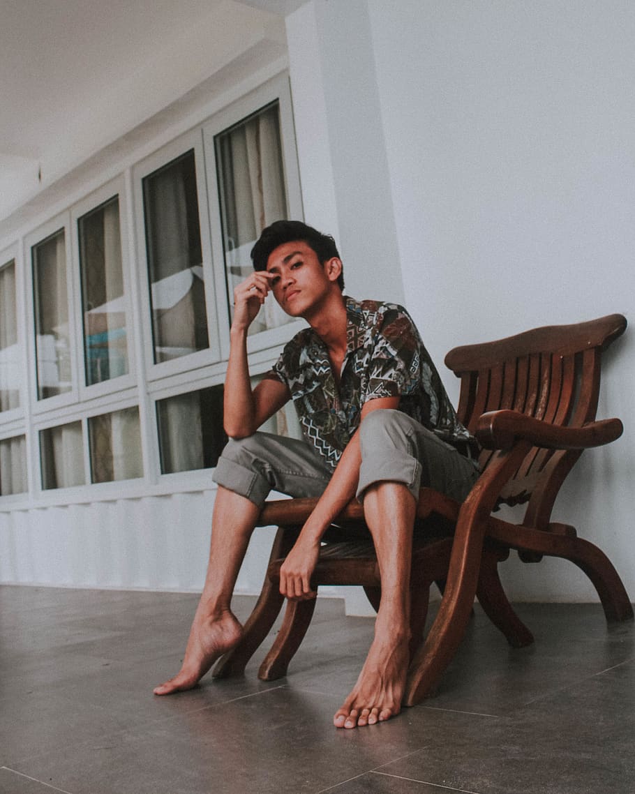 Photo of Man Sitting on Brown Wooden Armchair, photoshoot, posing HD wallpaper