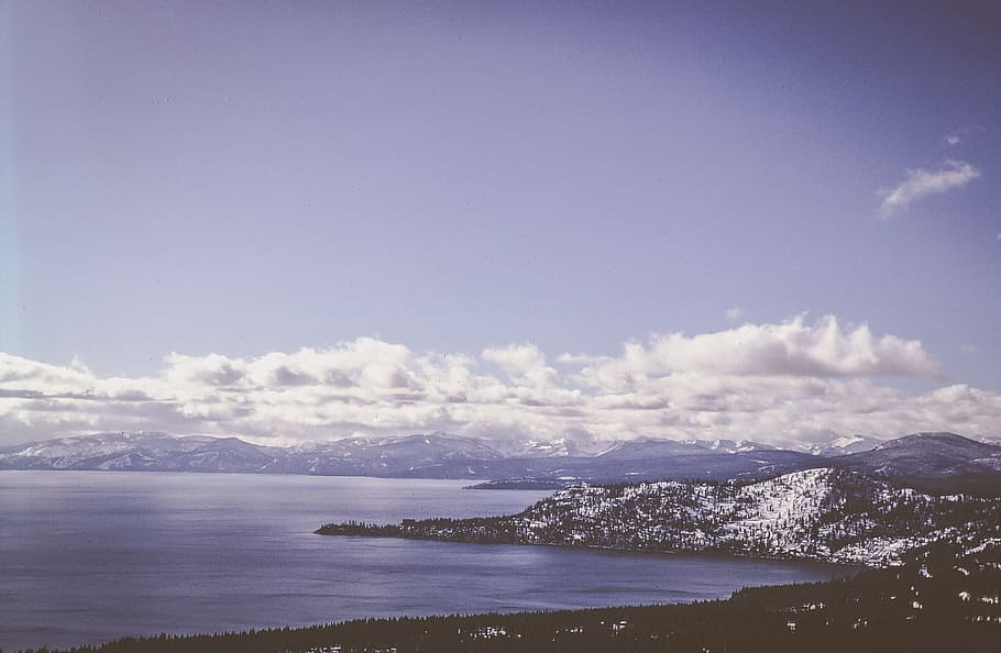 Clouds over snow covered mountains and ocean, blue, cloudy, green HD wallpaper