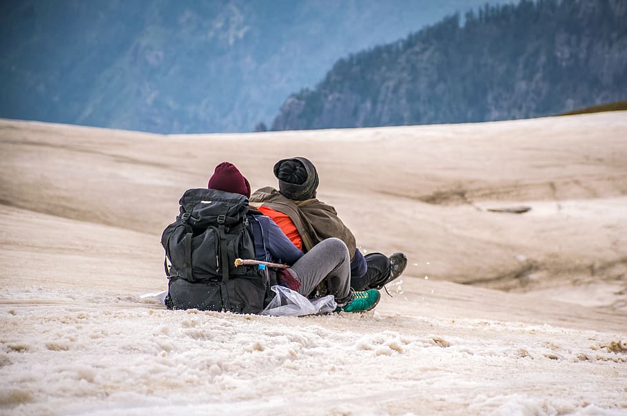 Two People Riding in Sled on Snow, action, adventure, cold, daylight HD wallpaper