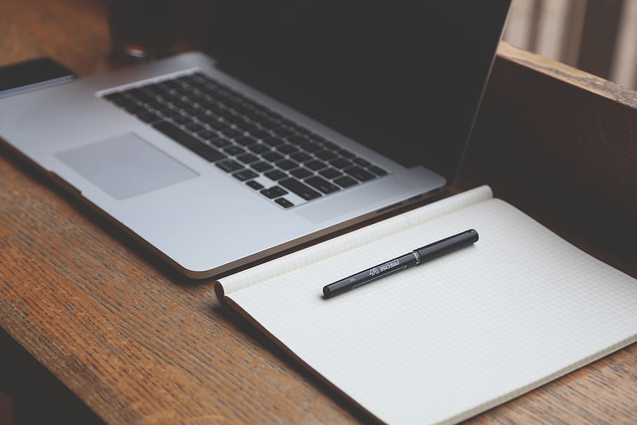 Macbook Pro Beside White Book, apple, desk, laptop, notebook HD wallpaper