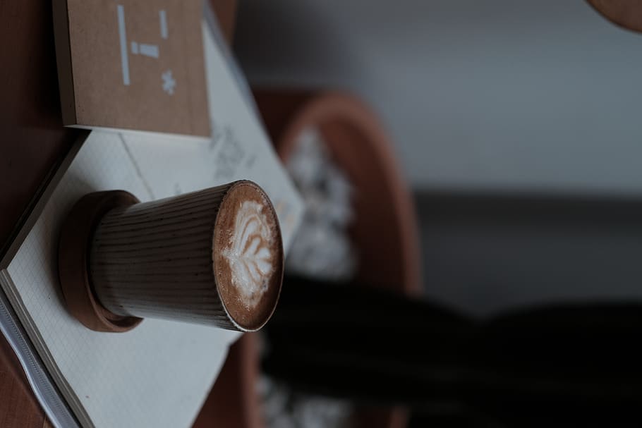 cappuccino in cup on opened book\, latte, drink, beverage, coffee cup HD wallpaper