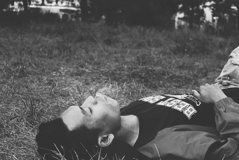 man lying on grass, person, human, face, apparel, clothing, plant HD wallpaper