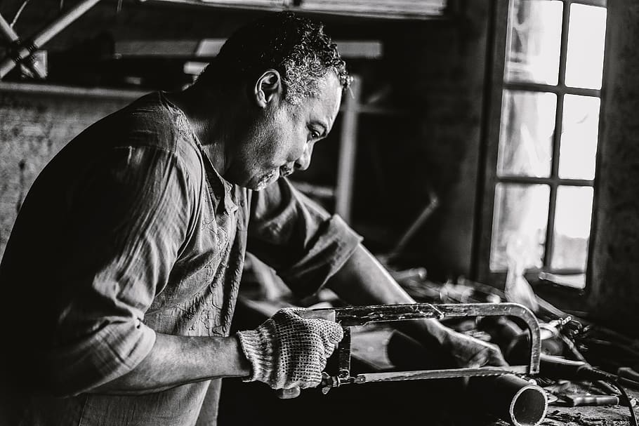 man holding hack saw, one person, indoors, real people, men, casual clothing HD wallpaper