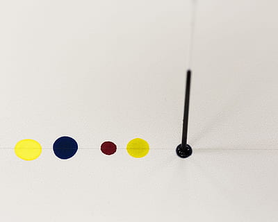 Spotting colored solutions on a thin layer chromatography plate HD wallpaper