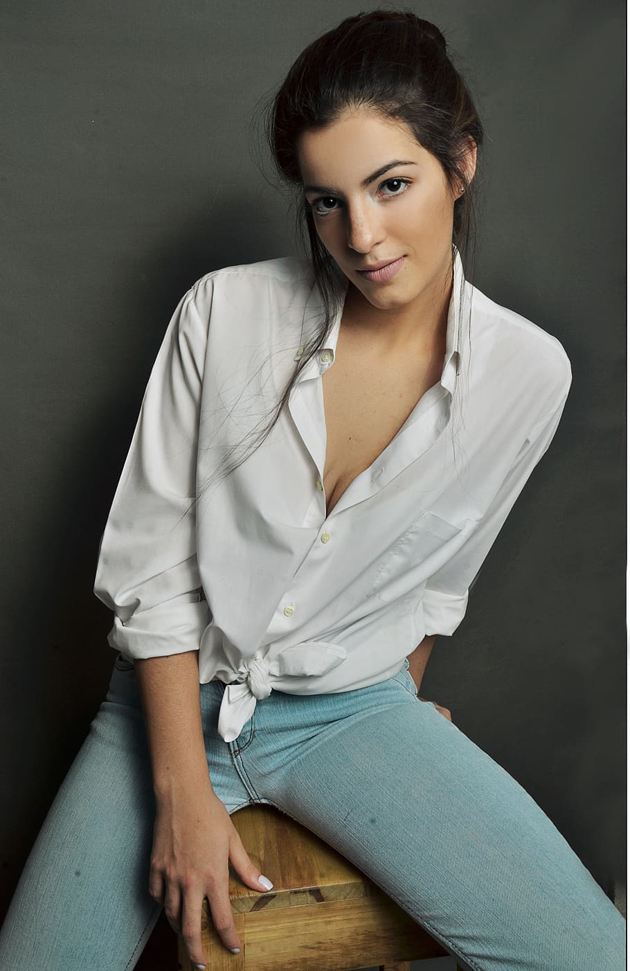 woman-in-white-dress-shirt-sitting-on-brown-wooden-stool.jpg