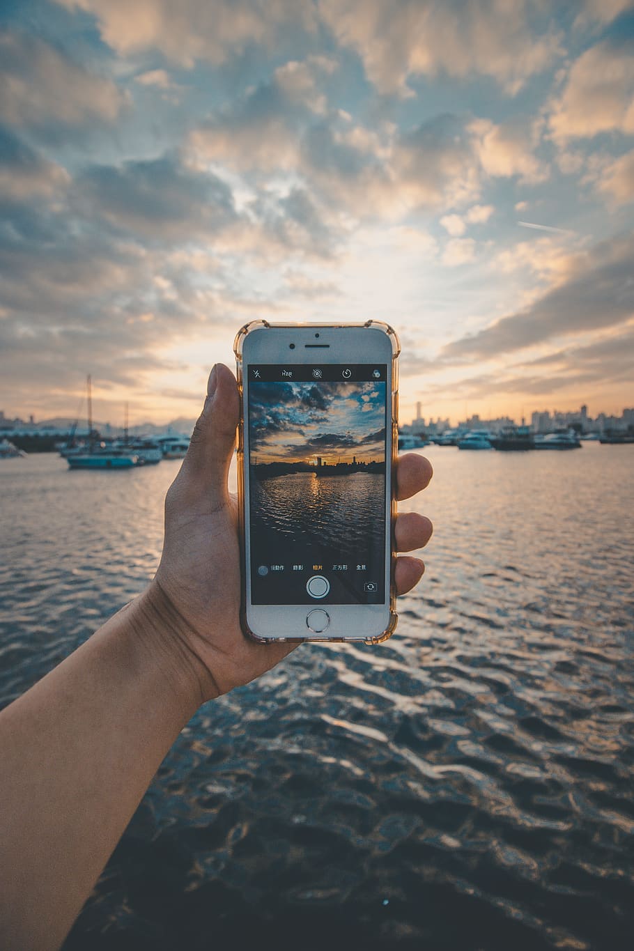 gold iPhone 6 held over the water at harbor, mobile phone, electronics, HD wallpaper