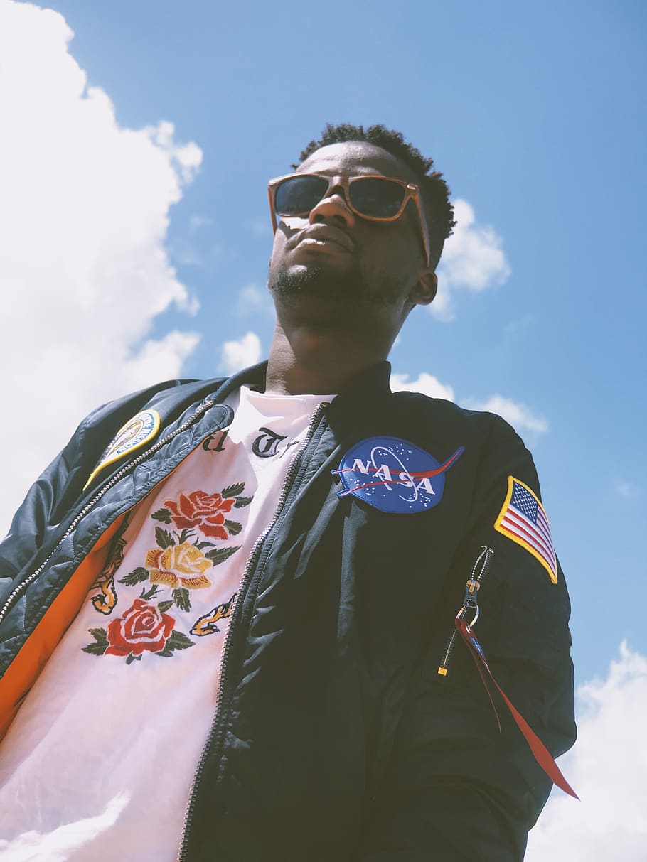 man wearing Nasa jacket, glasses, sky, lifestyles, low angle view HD wallpaper