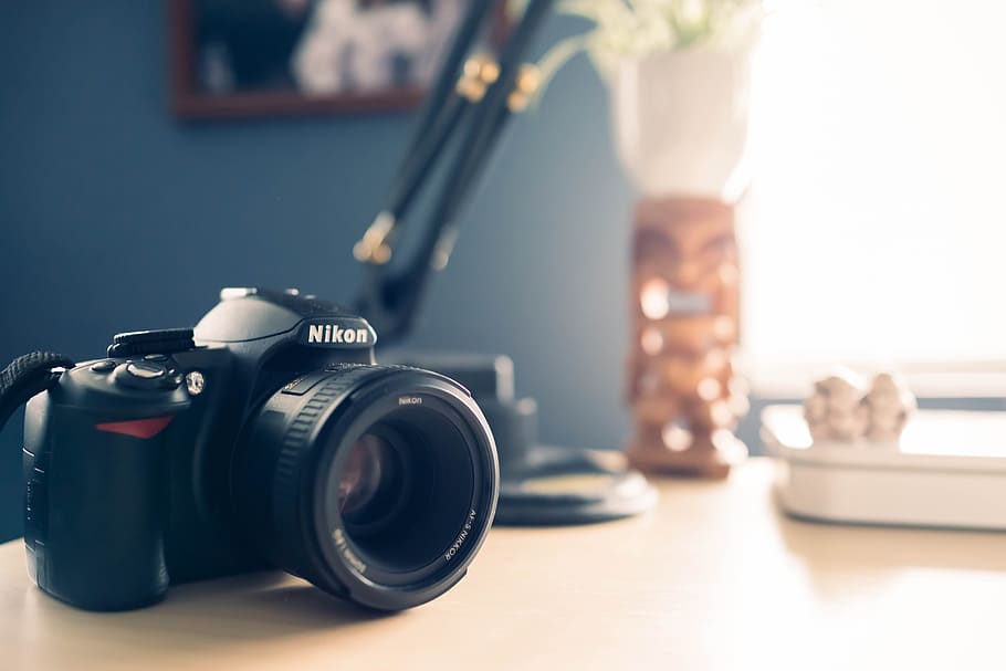 HD wallpaper: DSLR Camera Placed on an Office Desk with blur Background.  The background is the Other Office Items. | Wallpaper Flare