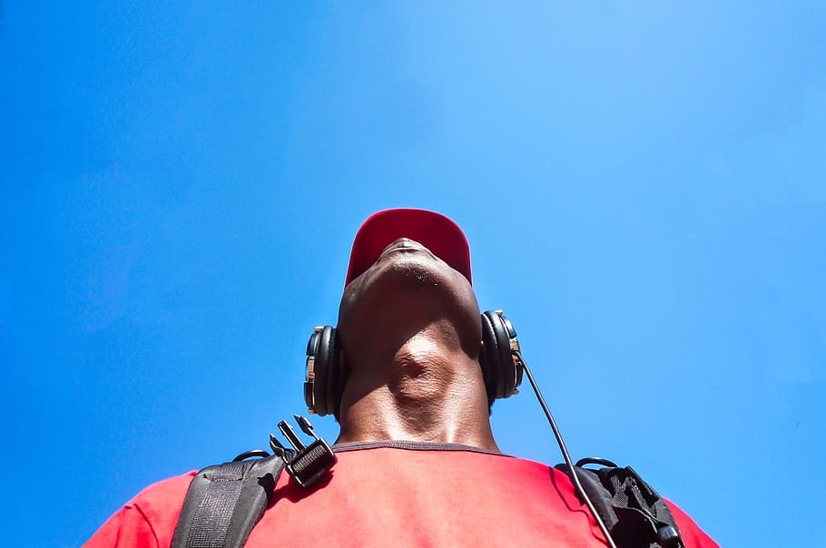 man looking up while wearing black headphones, portrait, headshot HD wallpaper