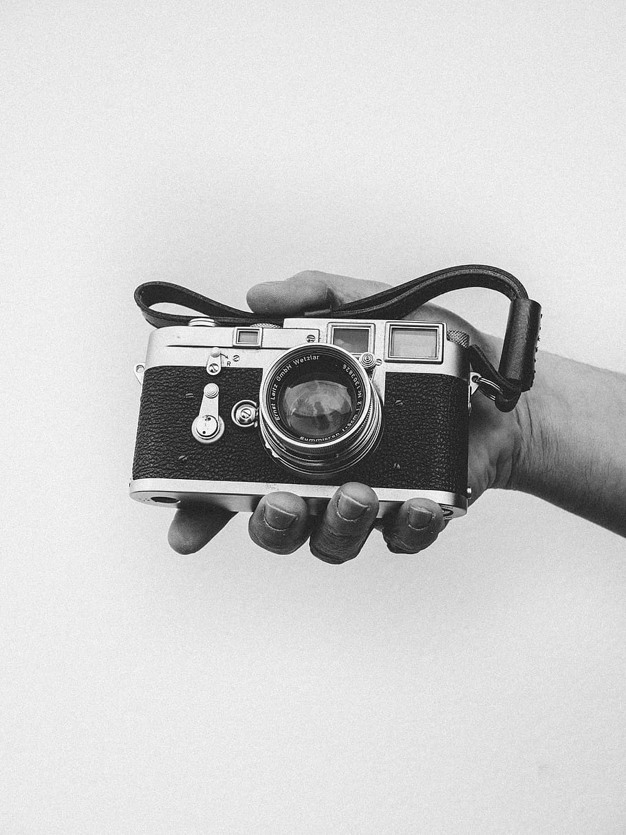 person holding black camera, human hand, one person, studio shot HD wallpaper