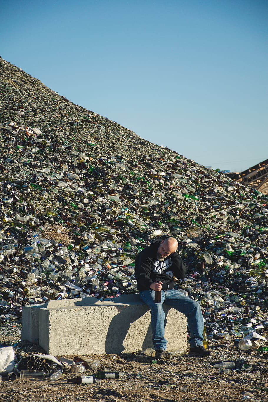 Man in Black Jacket Sitting on Green Concrete, daylight, environment HD wallpaper