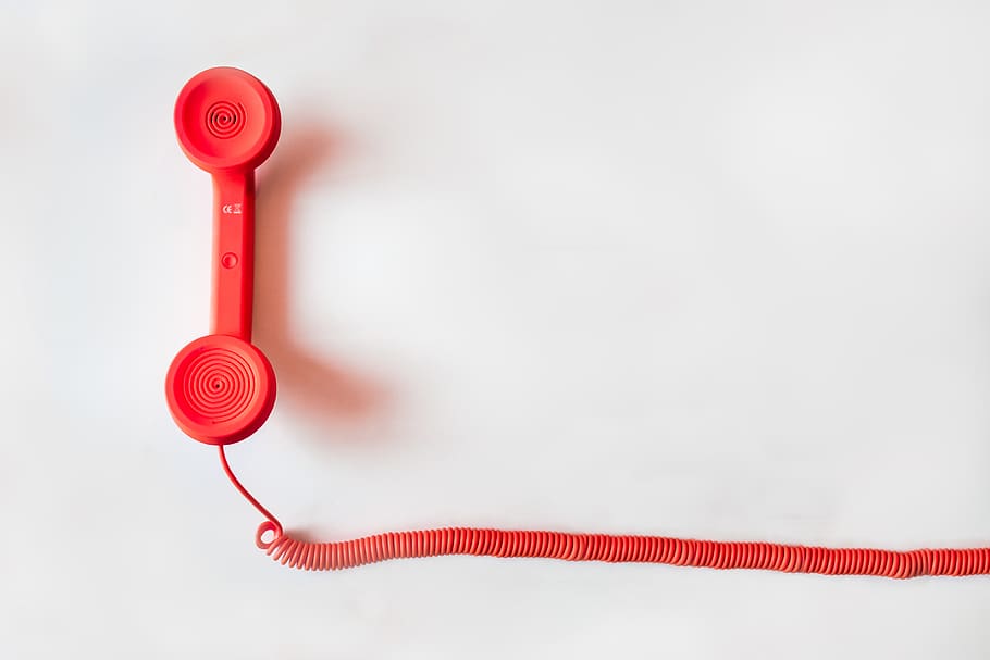 Red Corded Telephone on White Suraface, communication, contact