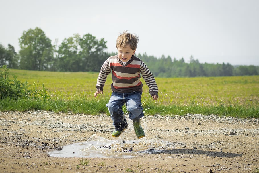 Boy Jumping Near Grass at Daytime, adorable, child, childhood