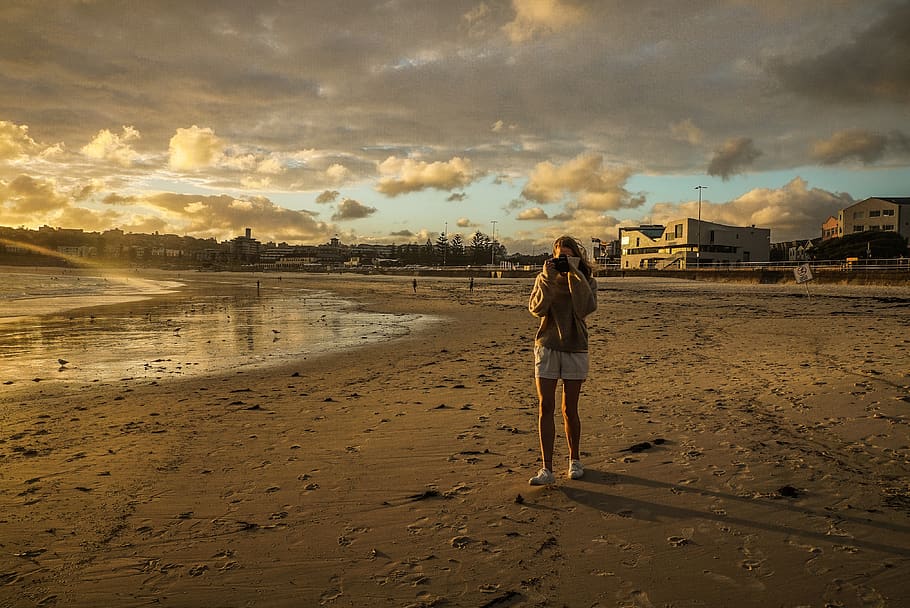 Woman Standing On Beach Shore, backlit, dawn, ocean, person, sand HD wallpaper