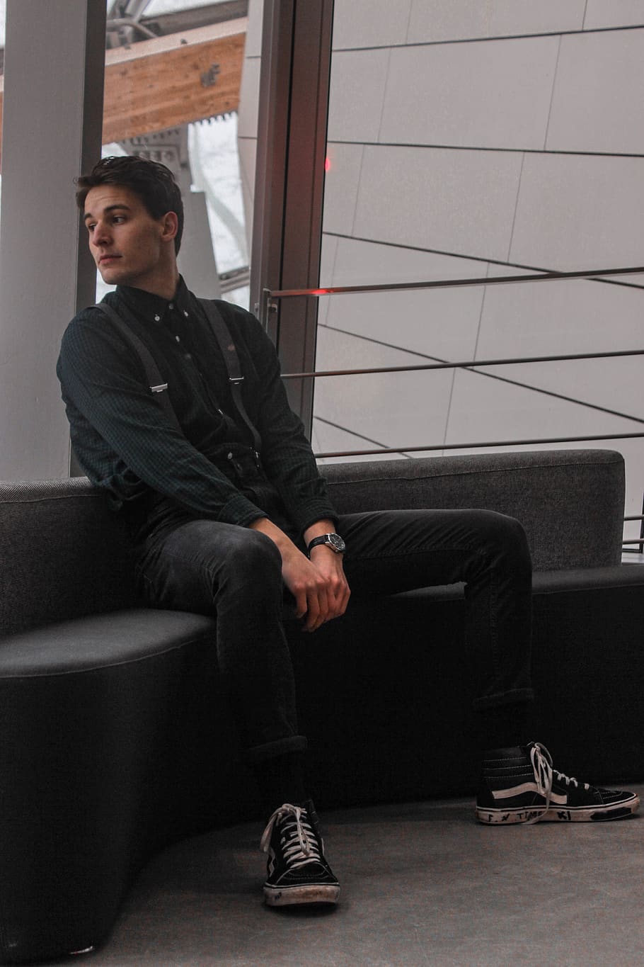 man sitting on black sofa, apparel, clothing, shoe, footwear HD wallpaper