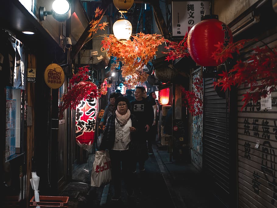 people walking between buildings, person, human, lighting, lantern HD wallpaper