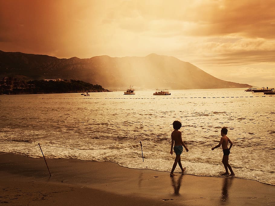 two children walking on beach during sunset, water, land, childhood HD wallpaper