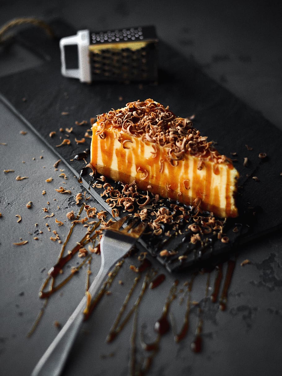 slice-of-caramel-cake-on-black-plate-beside-fork.jpg