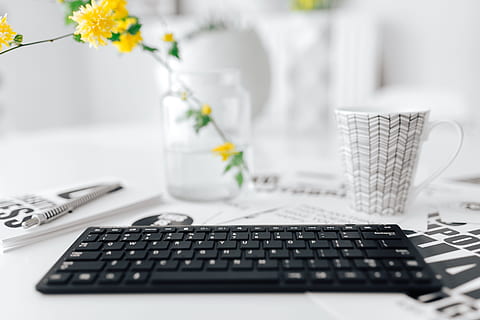Female hands typing on the remote wireless computer keyboard HD wallpaper