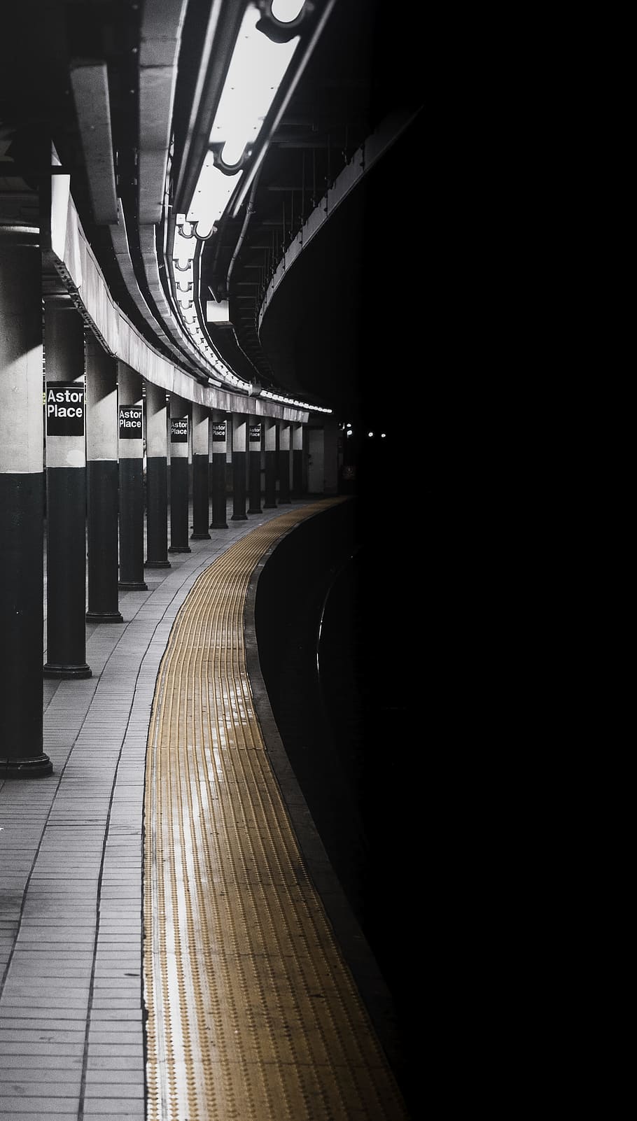 grayscale photo of train rail on tunnel, platform, light, column HD wallpaper