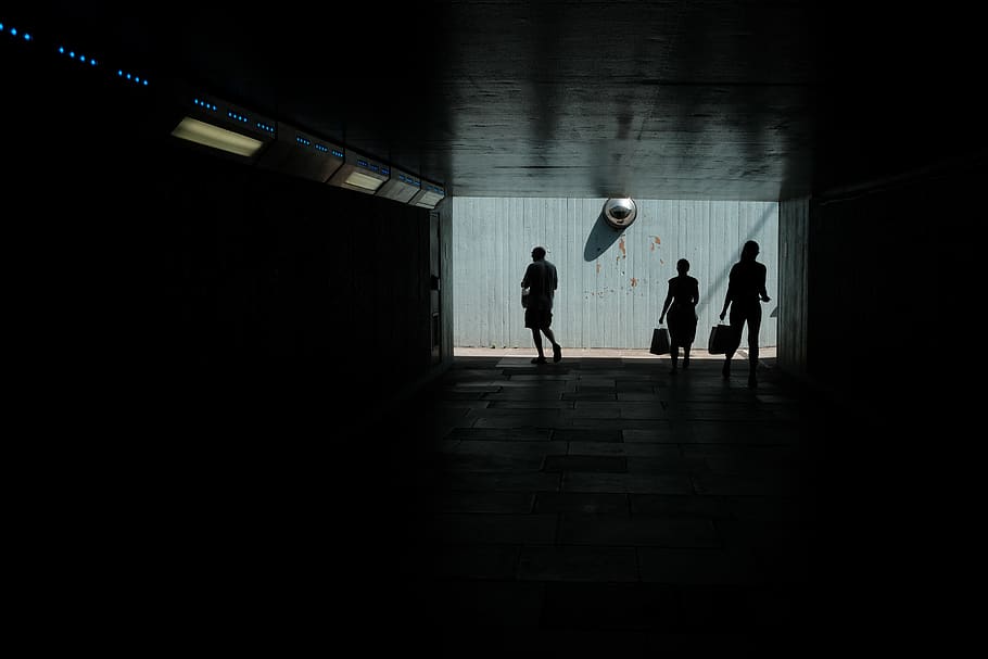 three persons walking through dark pathway, group of people, silhouette HD wallpaper