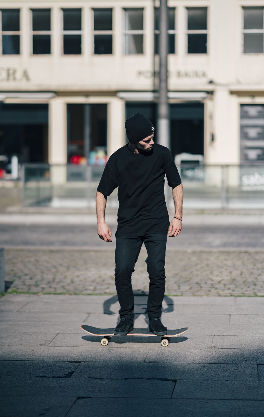 man in black shirt skating on pathway, human, person, apparel