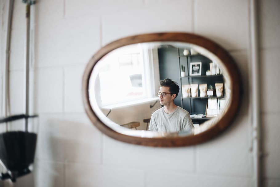 oval brown wooden framed mirror viewing man wearing sunglasses HD wallpaper