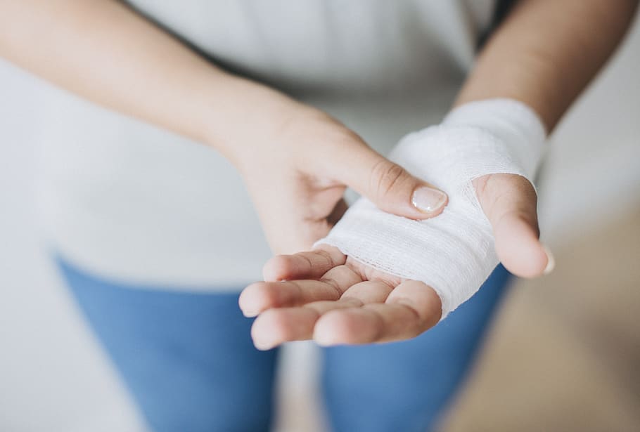 Person Holding White Hand Wrap, bandage, close-up, first aid