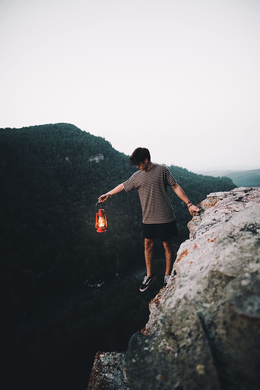 person holding lantern on cliff, man, male, light, rock, mountain, HD wallpaper