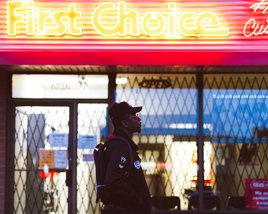 man standing on First Choice storefront, one person, text, real people HD wallpaper