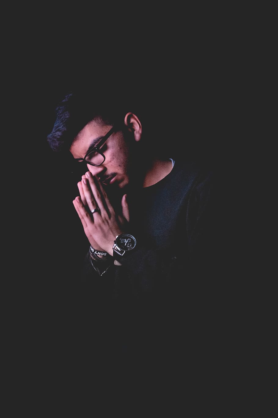 man praying, one person, black background, indoors, studio shot HD wallpaper
