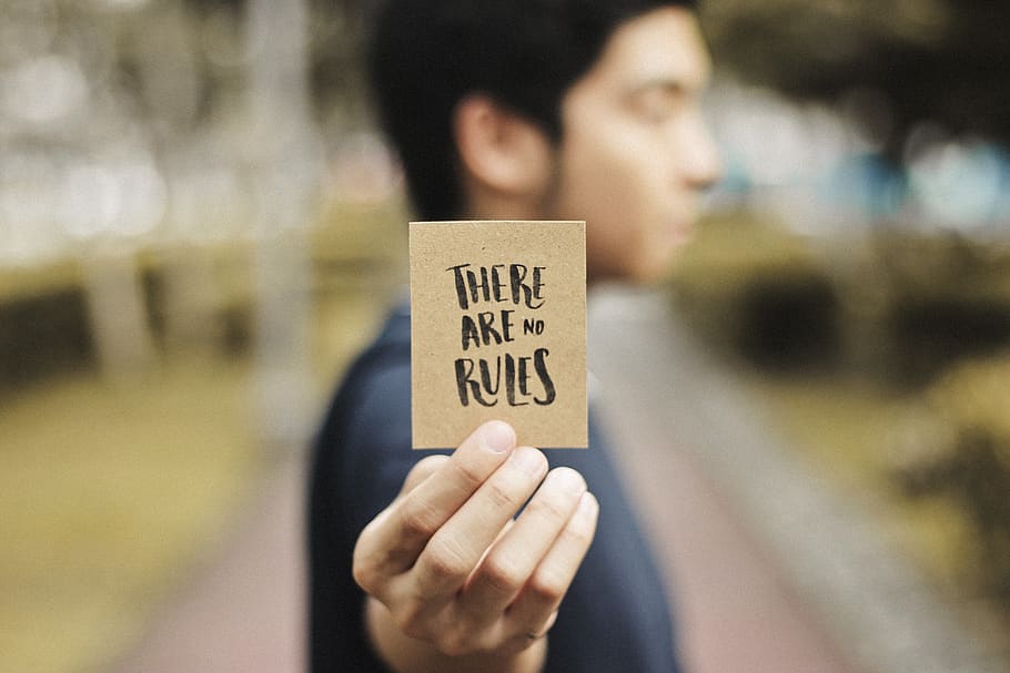 Person Holding Brown Card, blur, city, close-up, daylight, focus