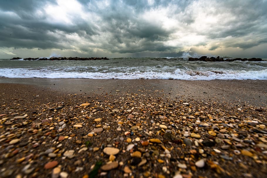 Brown And White Pebbles On Shore, beach, ocean, overcast, sand HD wallpaper