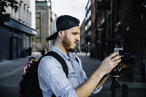 man using black DSLR camera, human, person, apparel, hat, clothing HD wallpaper