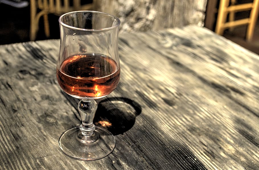 Footed Glass Filled With Brown Liquid on Brown Wooden Table, alcohol HD wallpaper