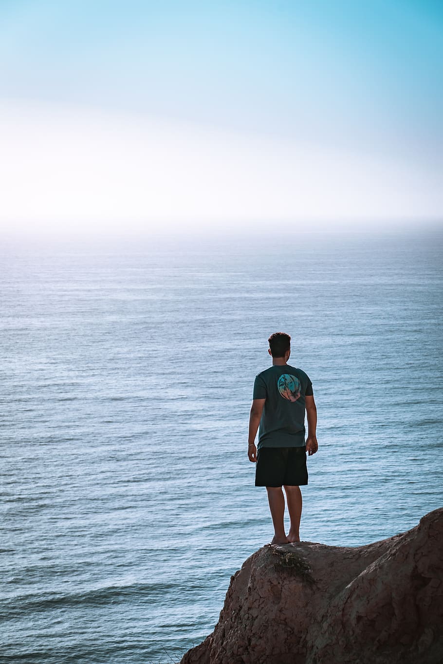 Man Standing on Cliff Near Sea, beach, daylight, landscape, leisure HD wallpaper