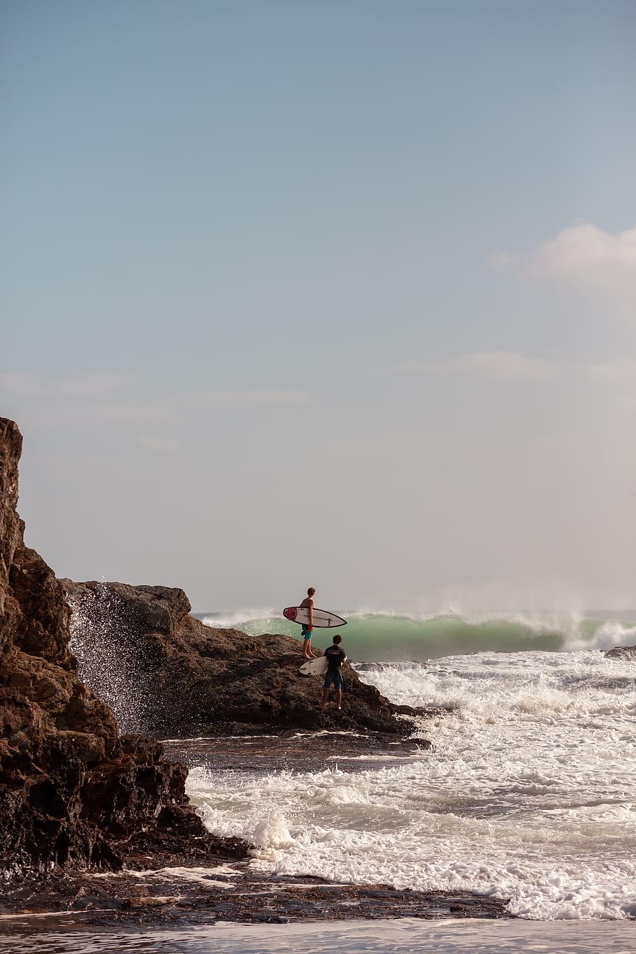 surfers on rock, sky, water, real people, one person, leisure activity HD wallpaper