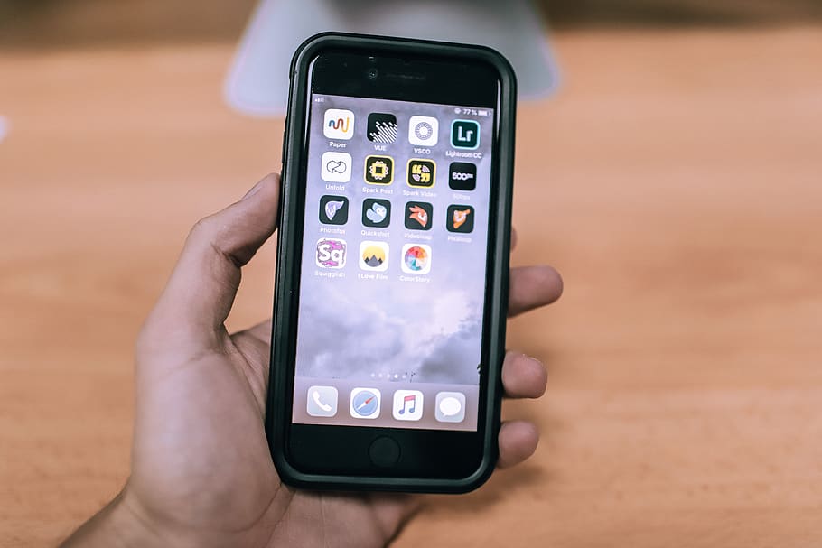 Person Holding Iphone Displaying Icons, cellular, cellular telephone HD wallpaper