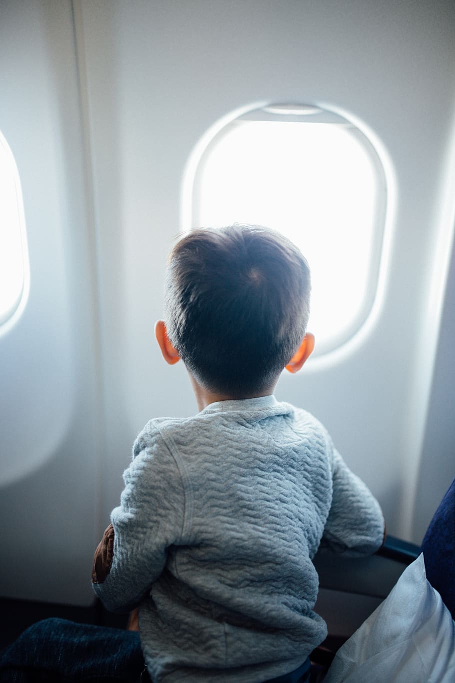 HD wallpaper: boy sitting on plane seat while viewing window, human, person  | Wallpaper Flare