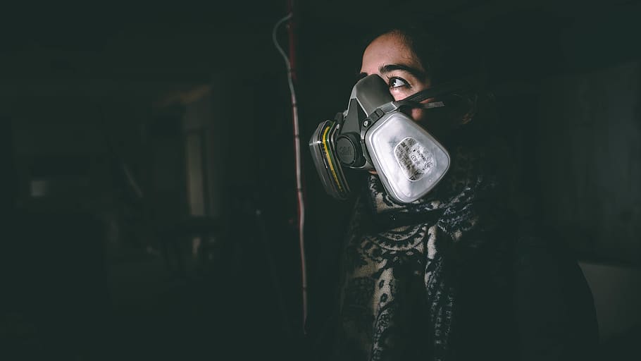 woman wearing black respirator, person, human, electronics, camera