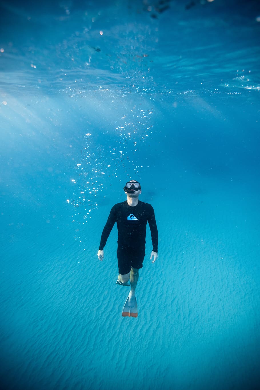man diving underwater