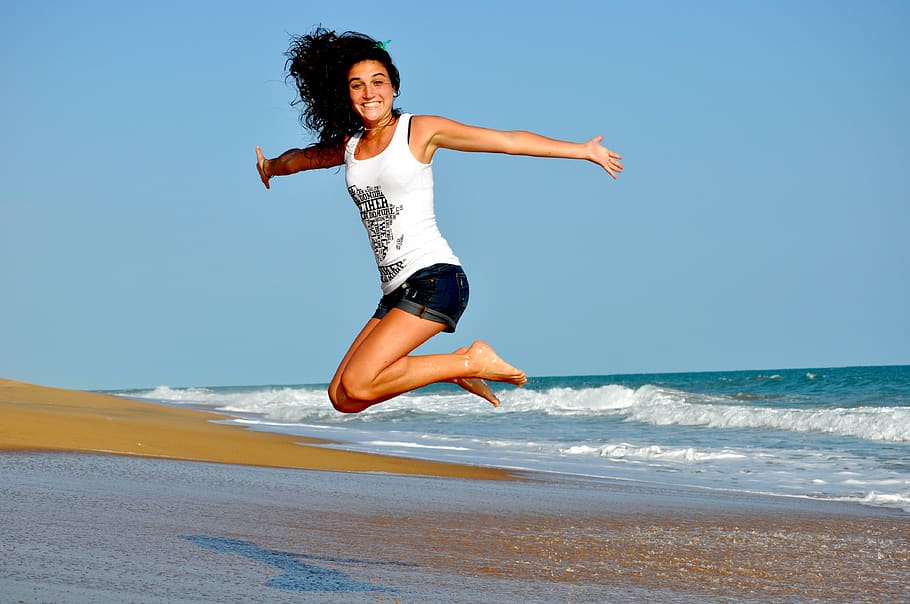 Woman in White Tanktop Jump over Beach Sand, beautiful, jumping HD wallpaper